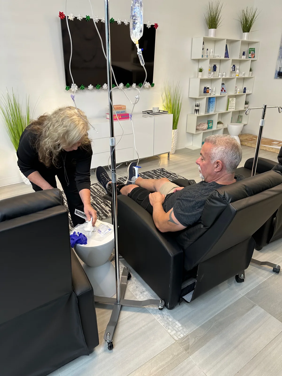 A RegenX practitioner preparing a client for treatment